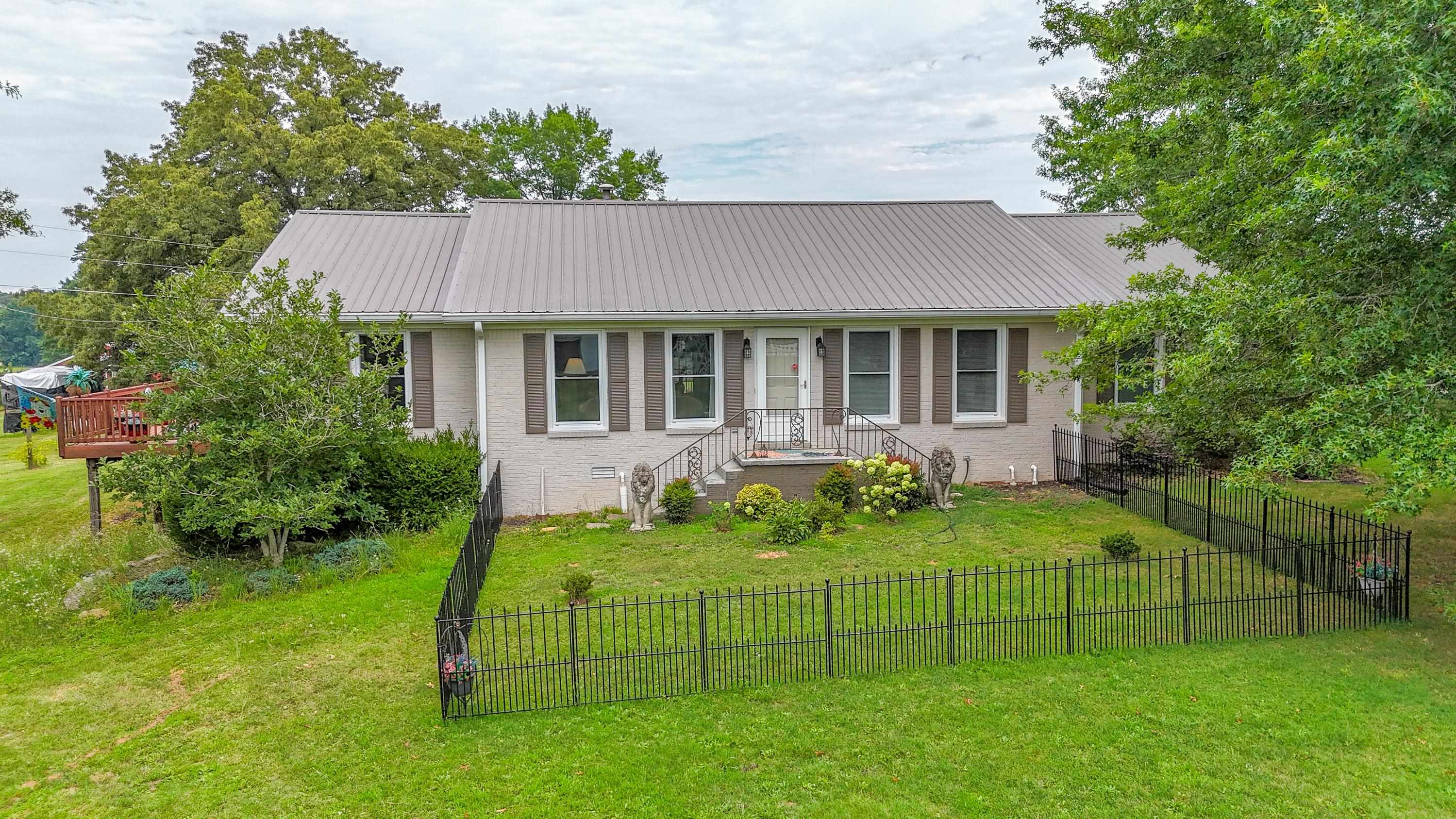 front view of a house with a yard