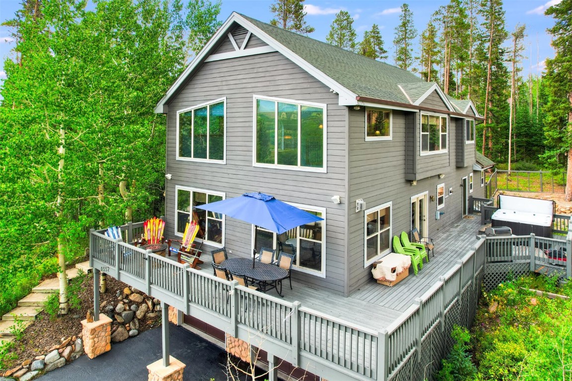 a view of house with a chairs and table in a patio