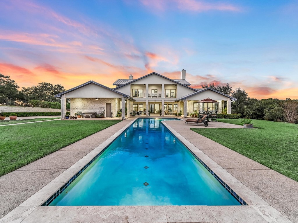 a view of swimming pool with outdoor seating