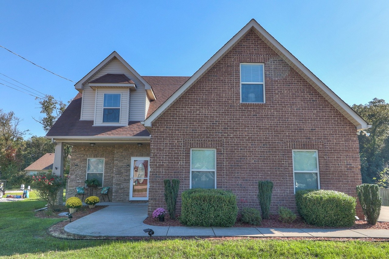 a front view of a house with garden