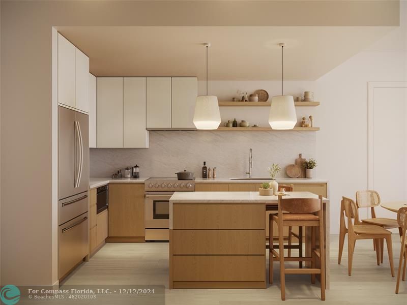 a kitchen with a stove a sink and white cabinets