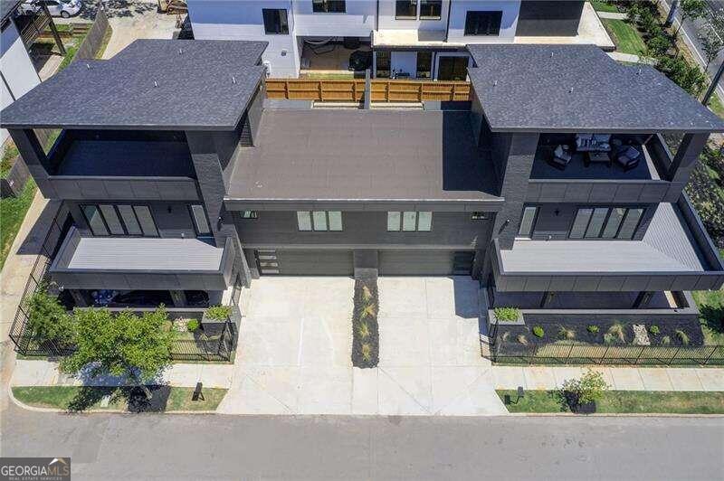 an aerial view of houses with yard