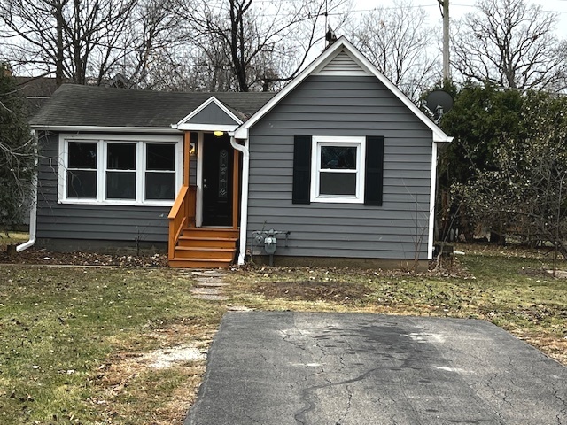 a front view of a house with garage