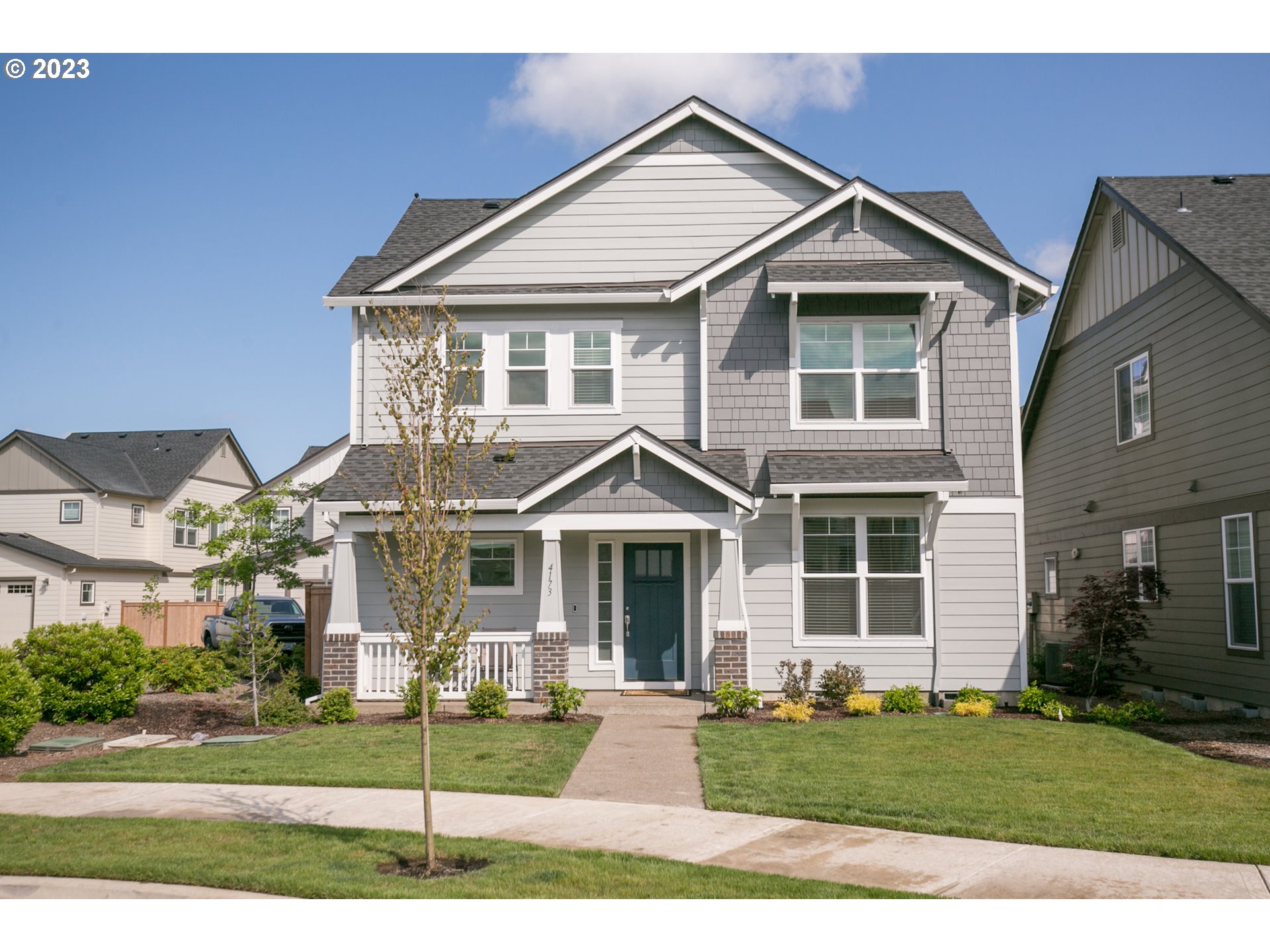 a front view of a house with a yard