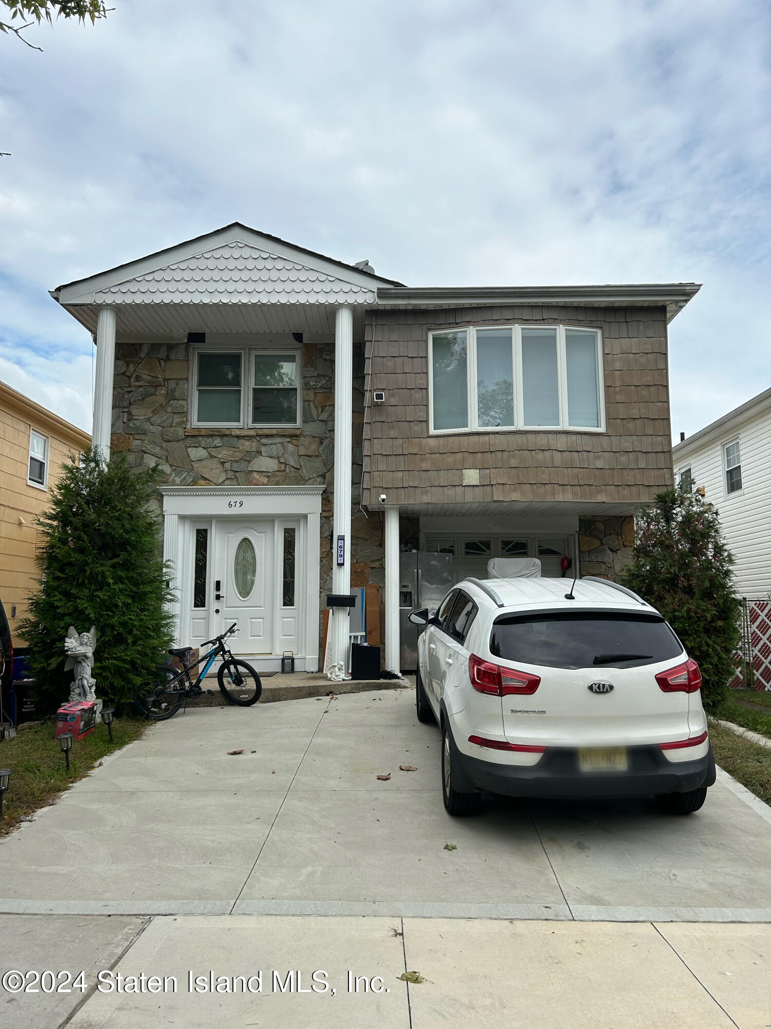 a car parked in front of a house