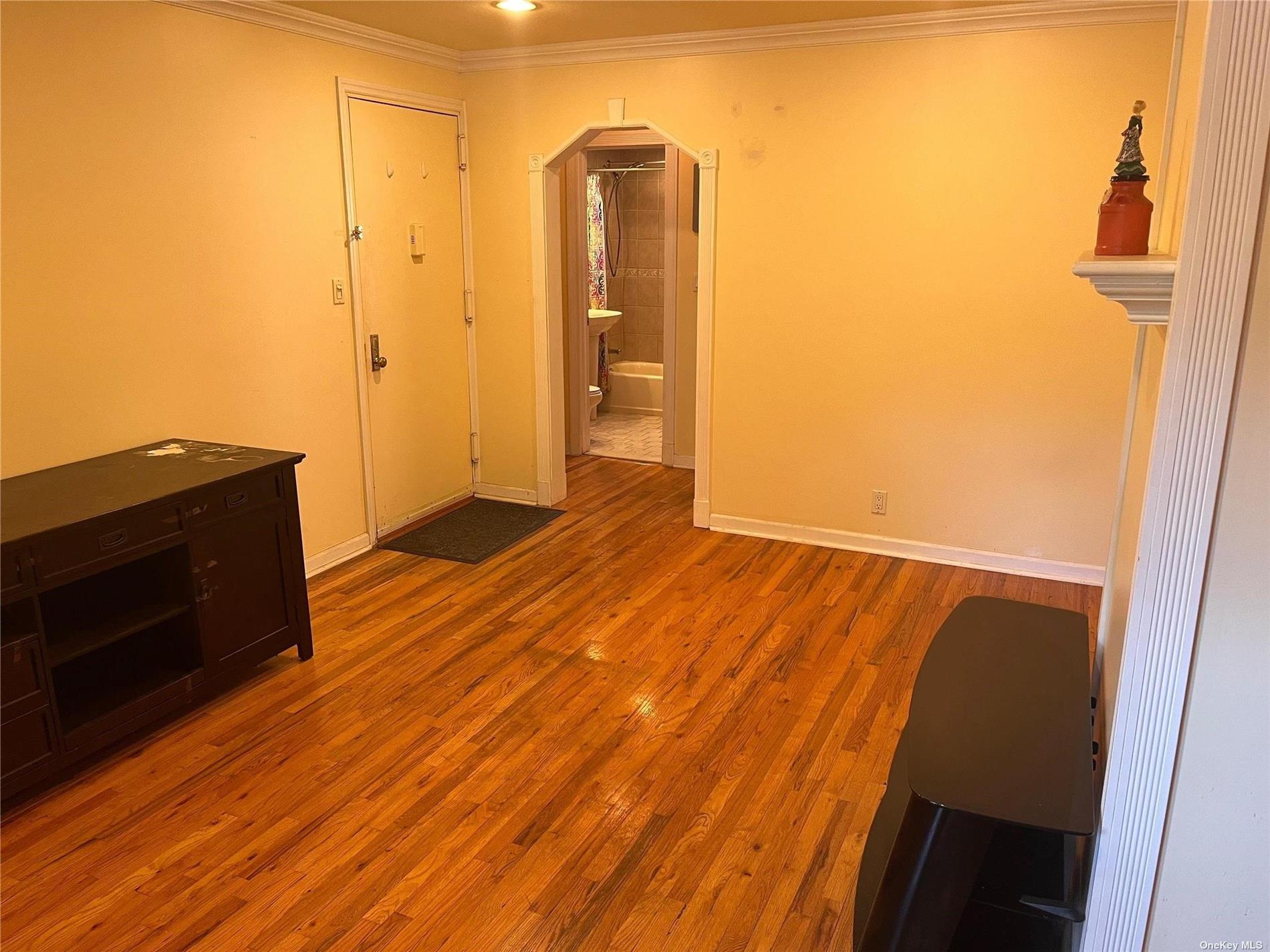 a view of a livingroom with wooden floor