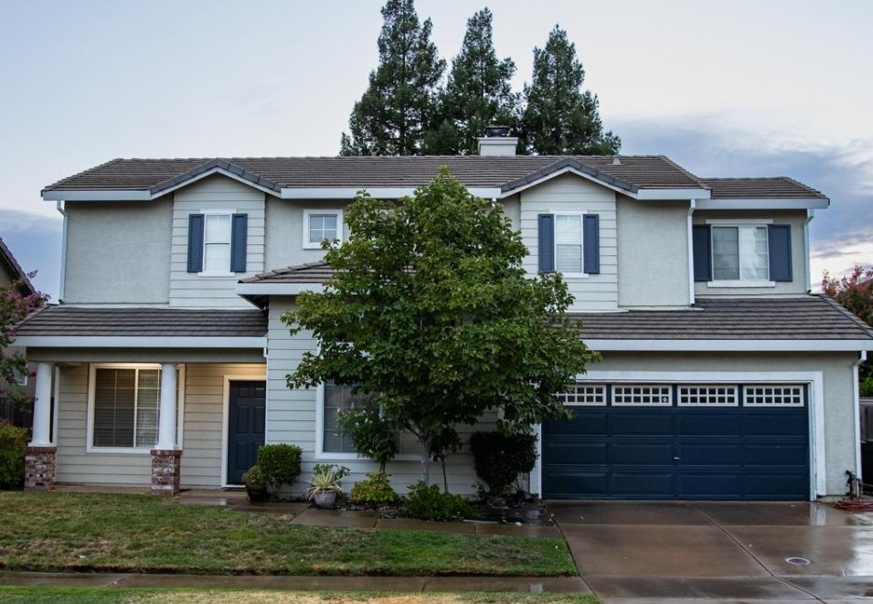 a front view of a house with a garage