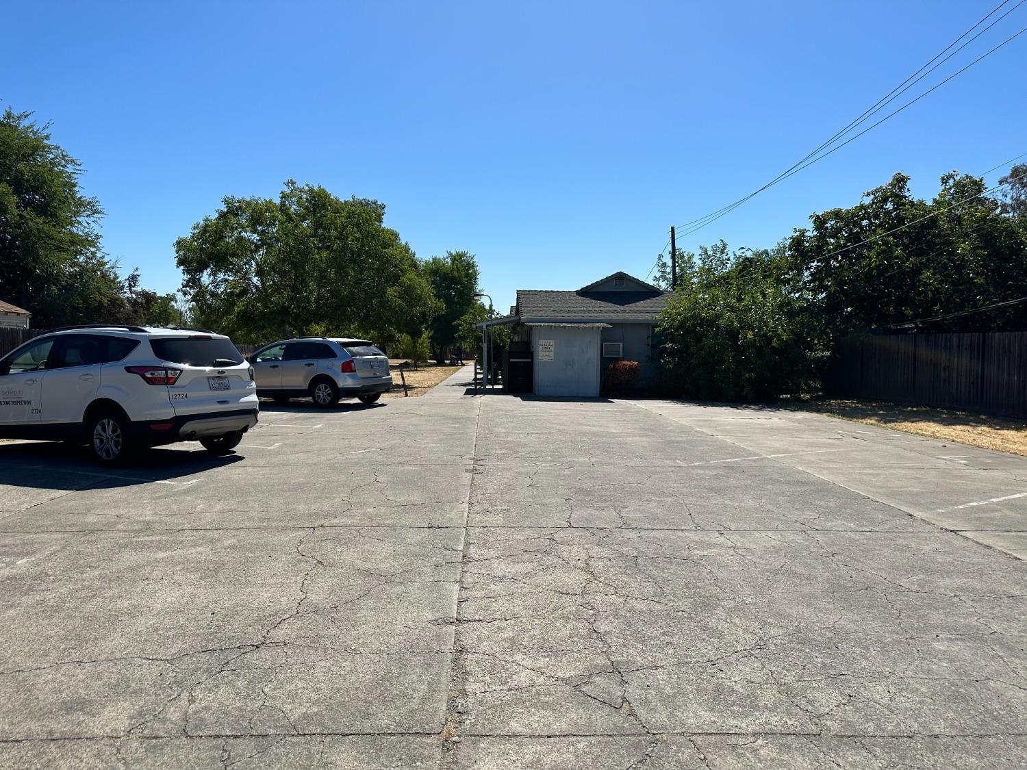 a view of street with parked cars