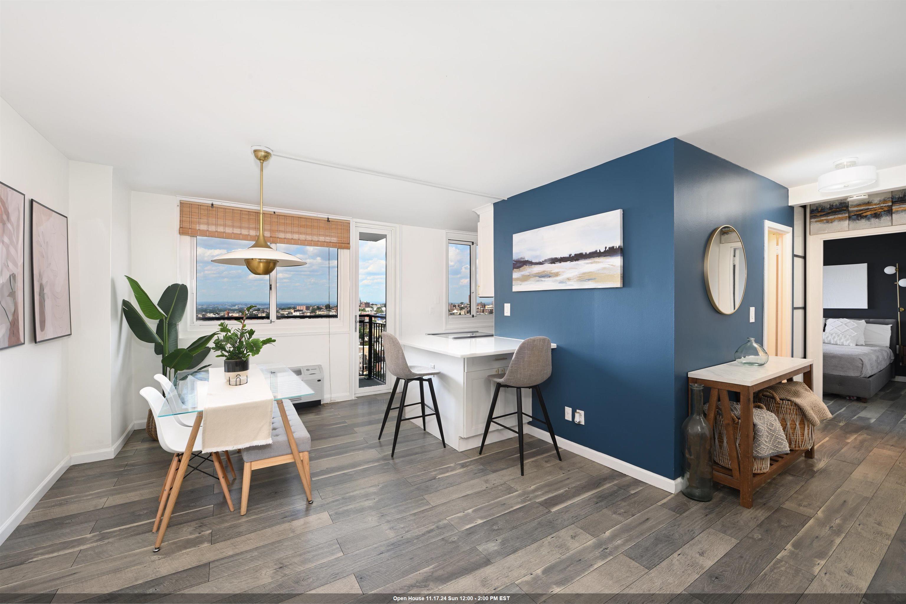 a dining room with wooden floor a glass table and chairs