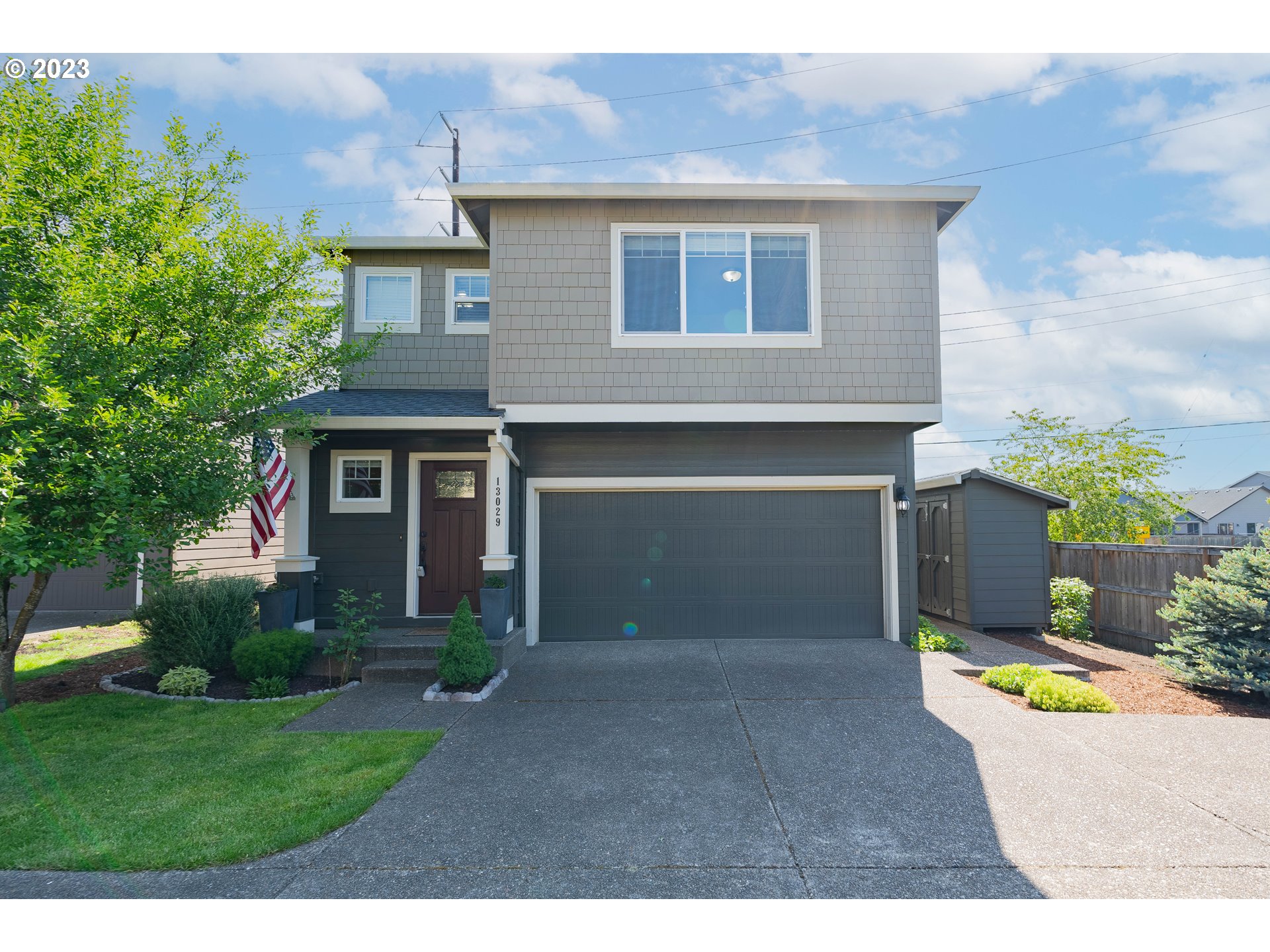 a front view of a house with a yard