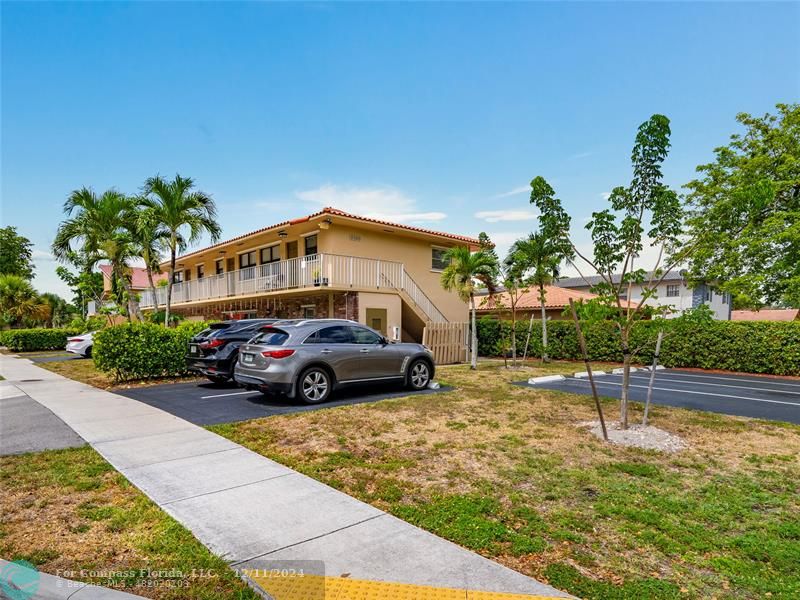 a view of a car park in front of a house