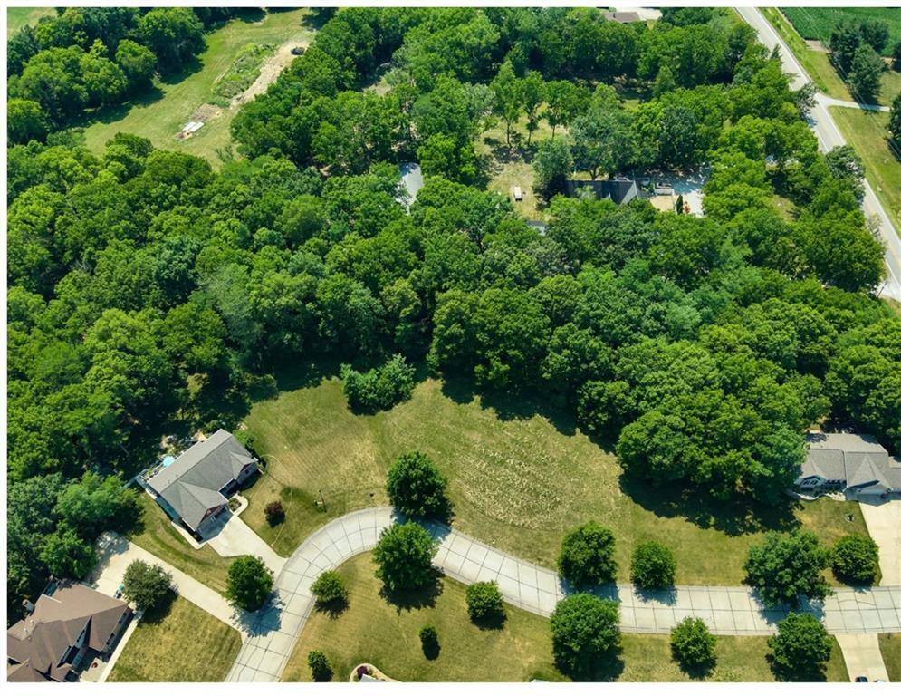 an aerial view of a house with yard