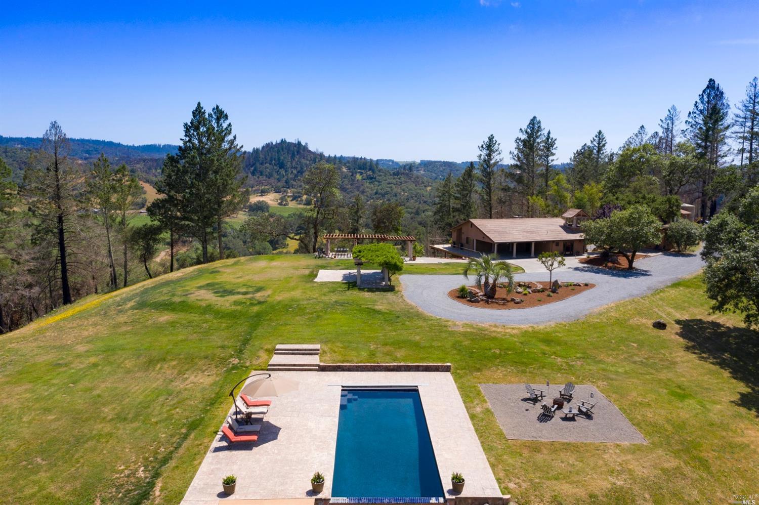 a view of a swimming pool with a patio