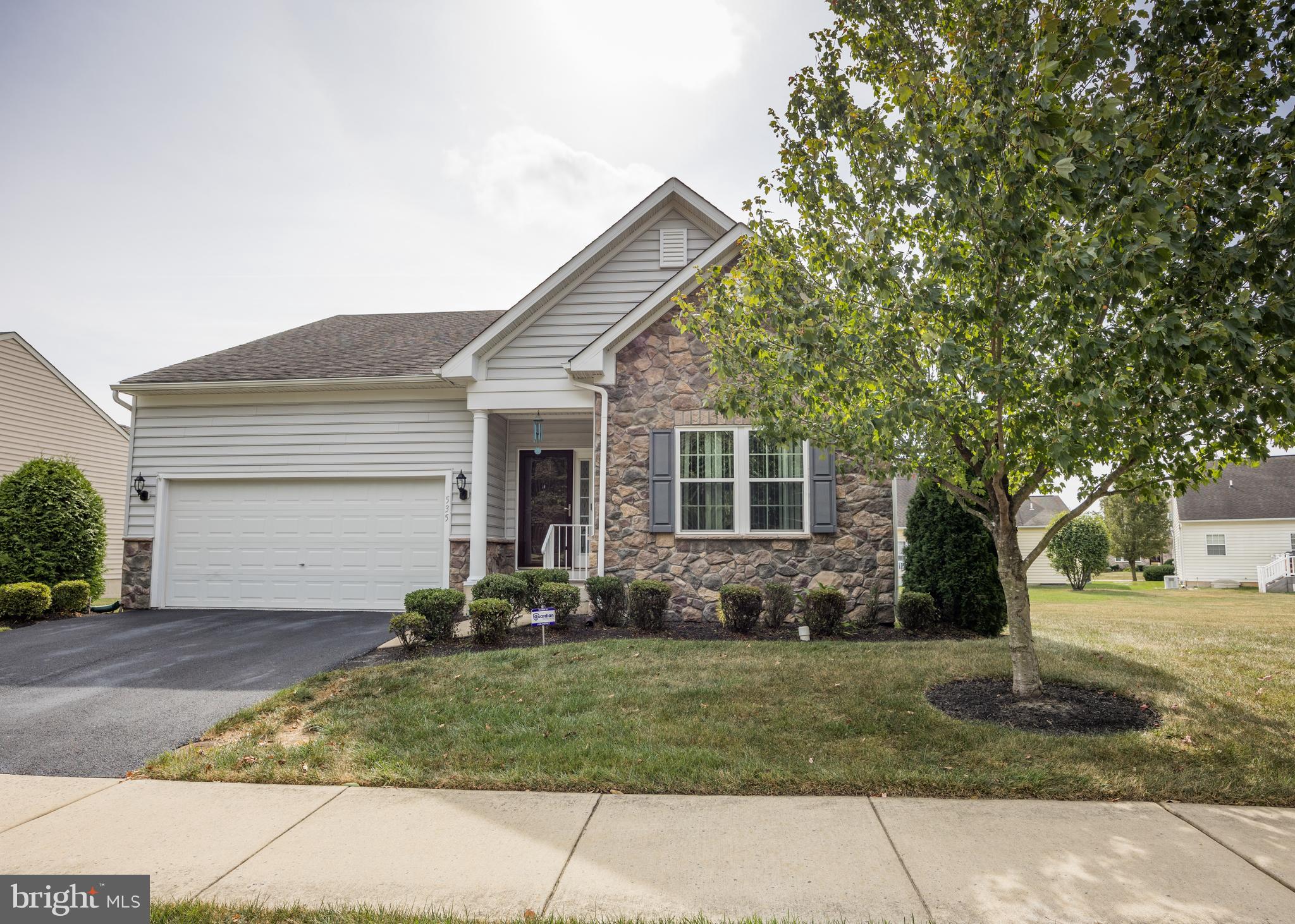 a front view of house with yard outdoor seating and barbeque oven