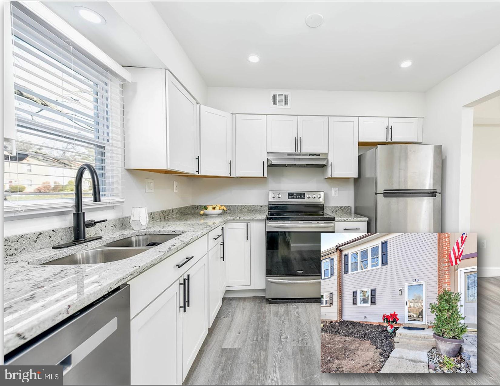 a kitchen with a sink stove and refrigerator