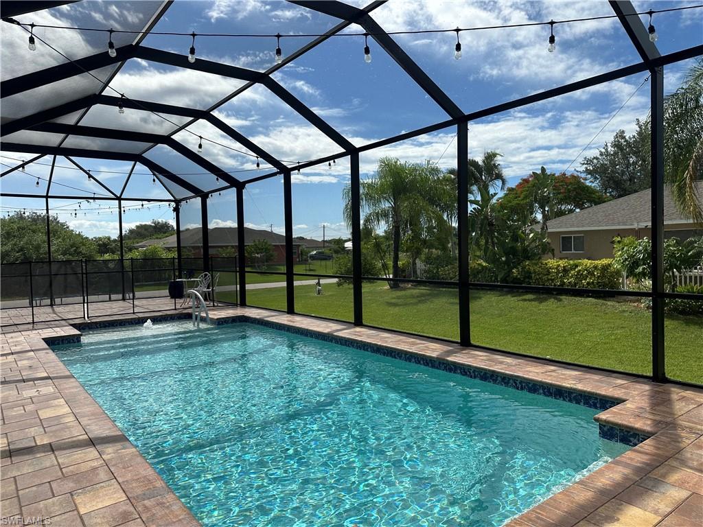 a view of a backyard with sitting area