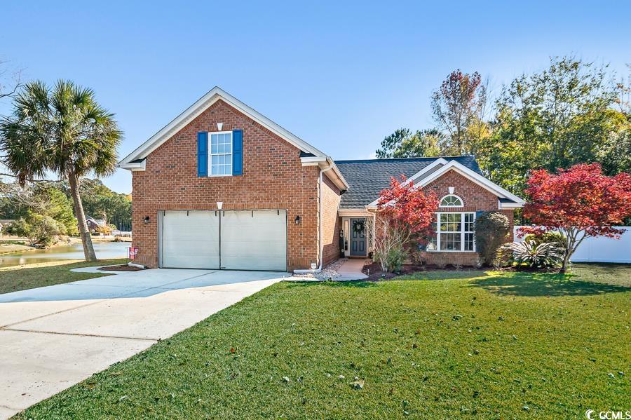 View of front property featuring a garage and a fr