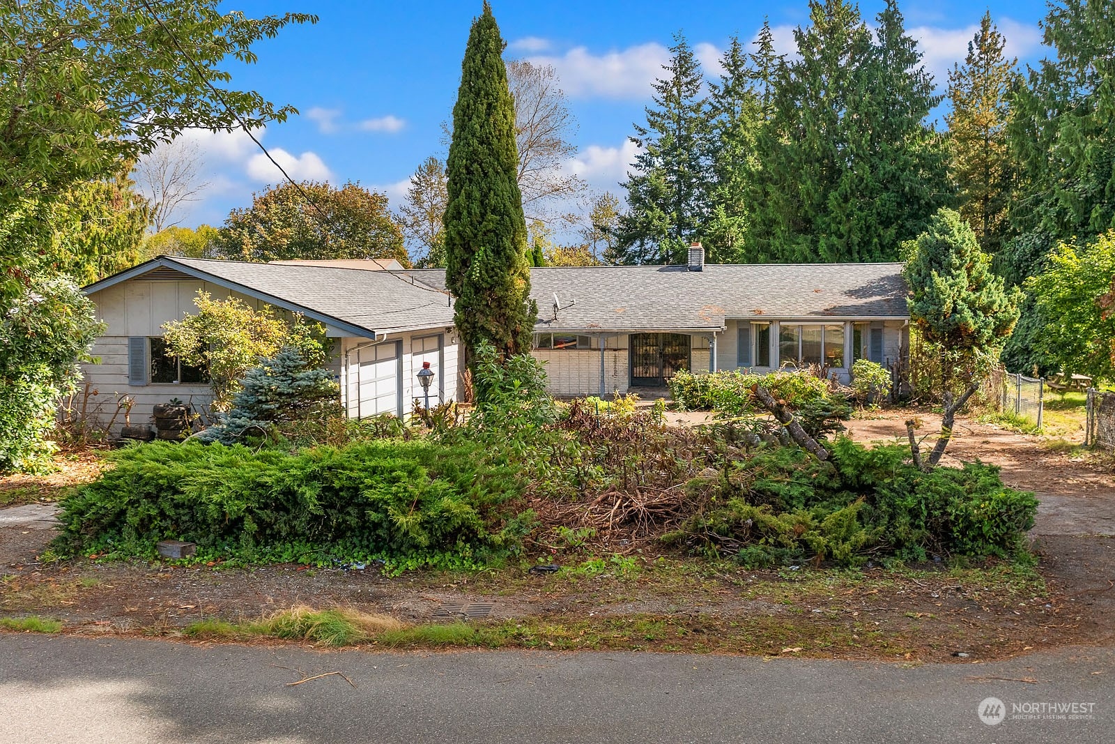 front view of a house with a garden