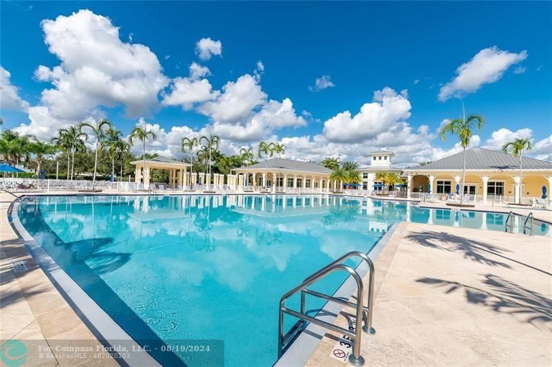 a view of a swimming pool with an outdoor seating