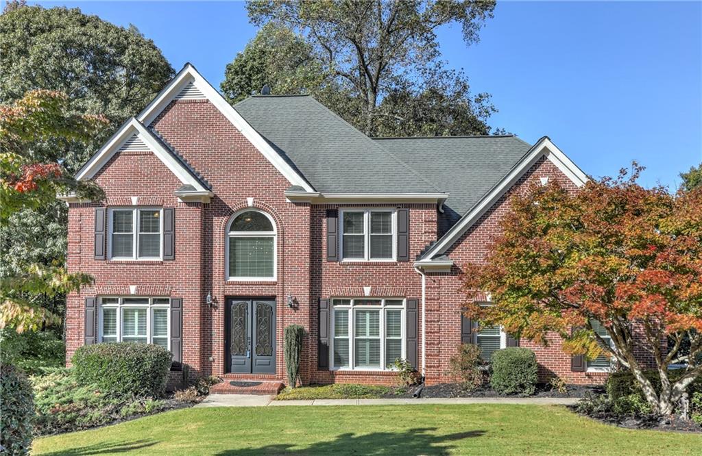 front view of a house with a yard