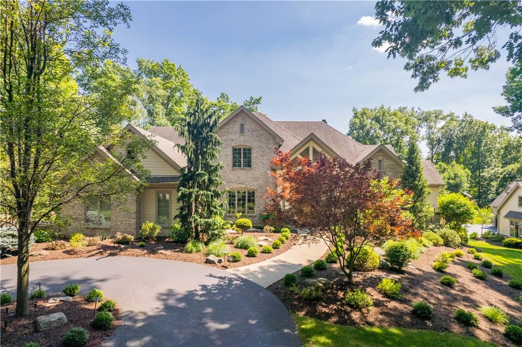 Stately driveway pillars await your entry.