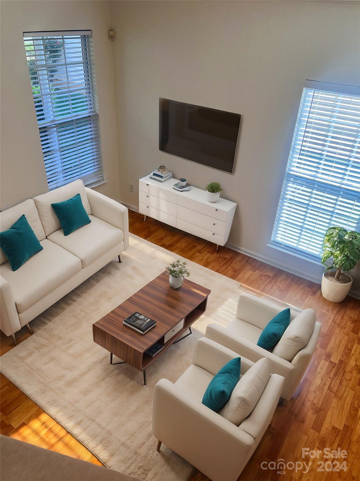 a living room with furniture and a flat screen tv