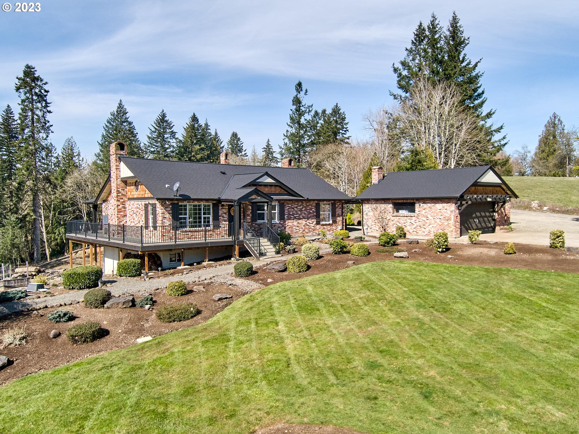 a aerial view of a house with swimming pool and sitting area