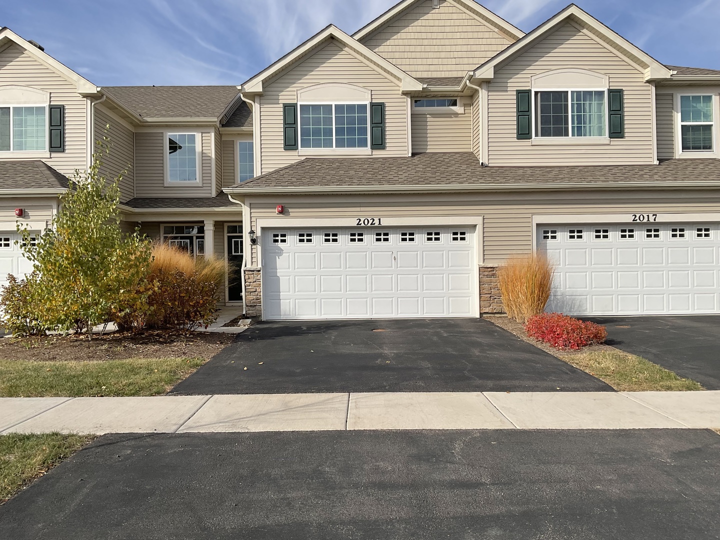 a front view of a house with yard