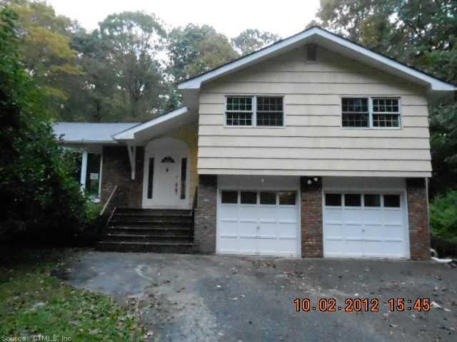 a front view of a house with a garage