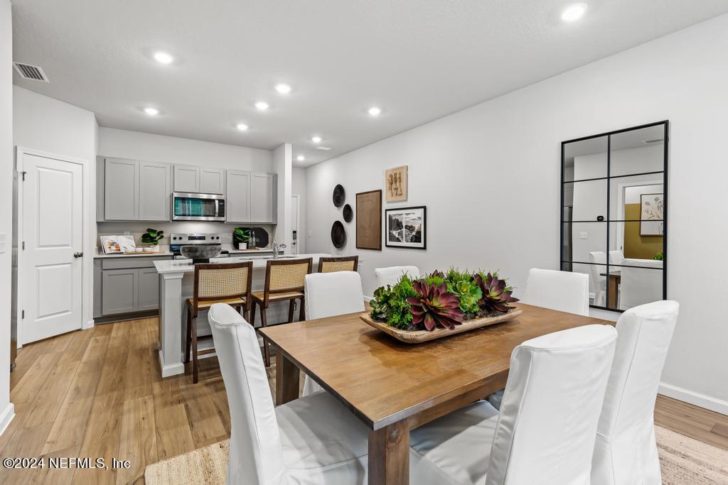 a kitchen with a table and chairs in it