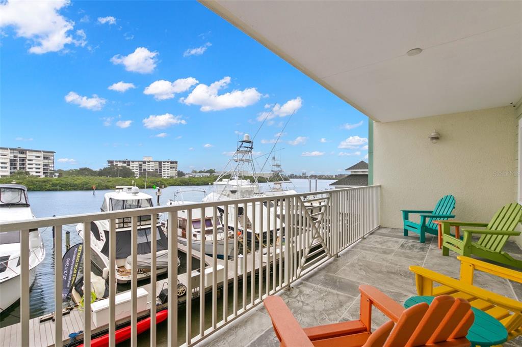 a view of a balcony with chairs