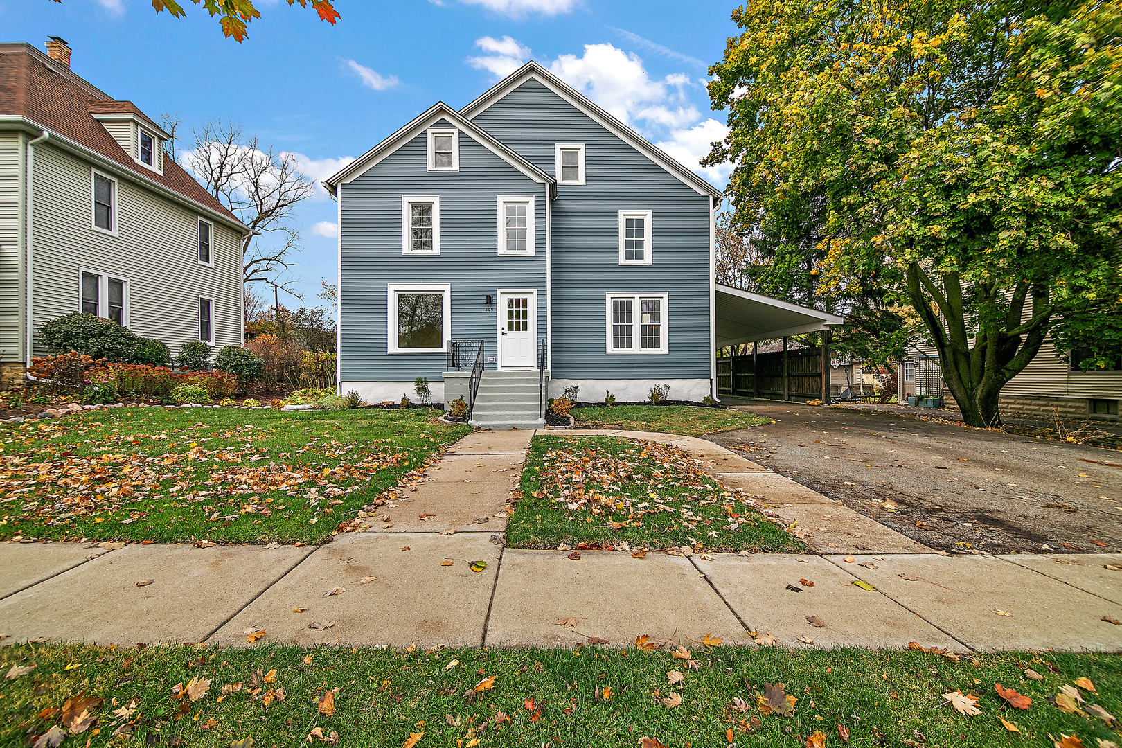 a front view of a house with a yard