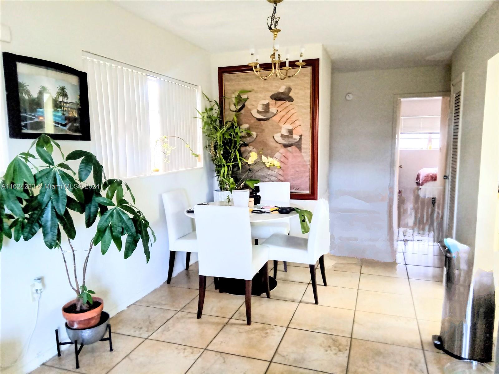 a workspace with furniture and a potted plant