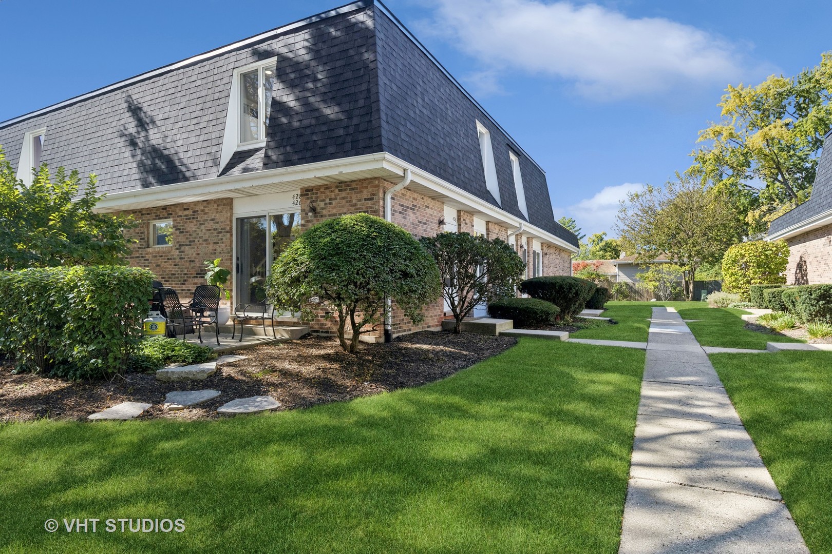 a front view of a house with a yard