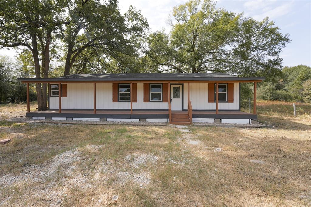 front view of a house with yard