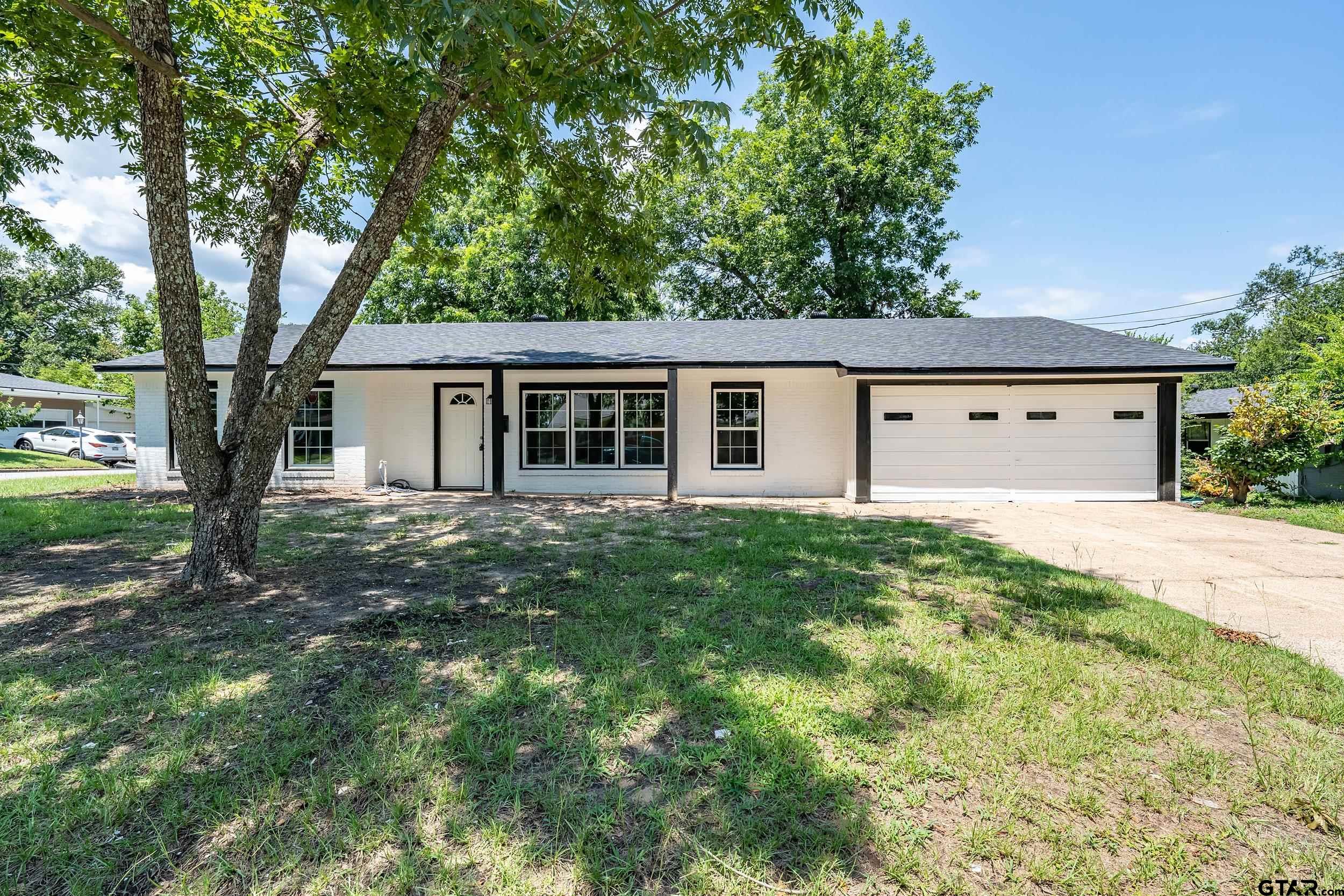 front view of a house with a yard