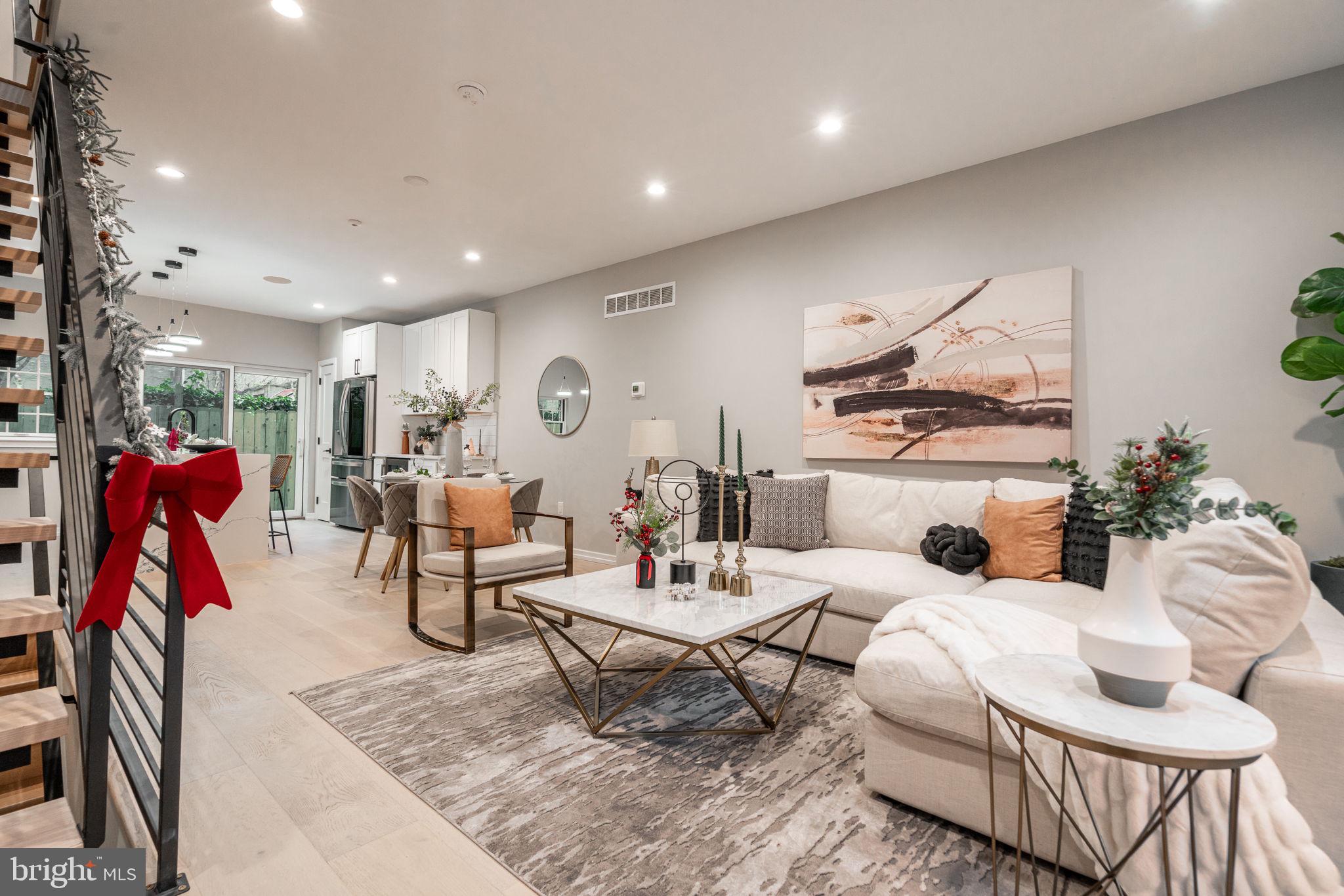 a living room with furniture gym equipment and a rug