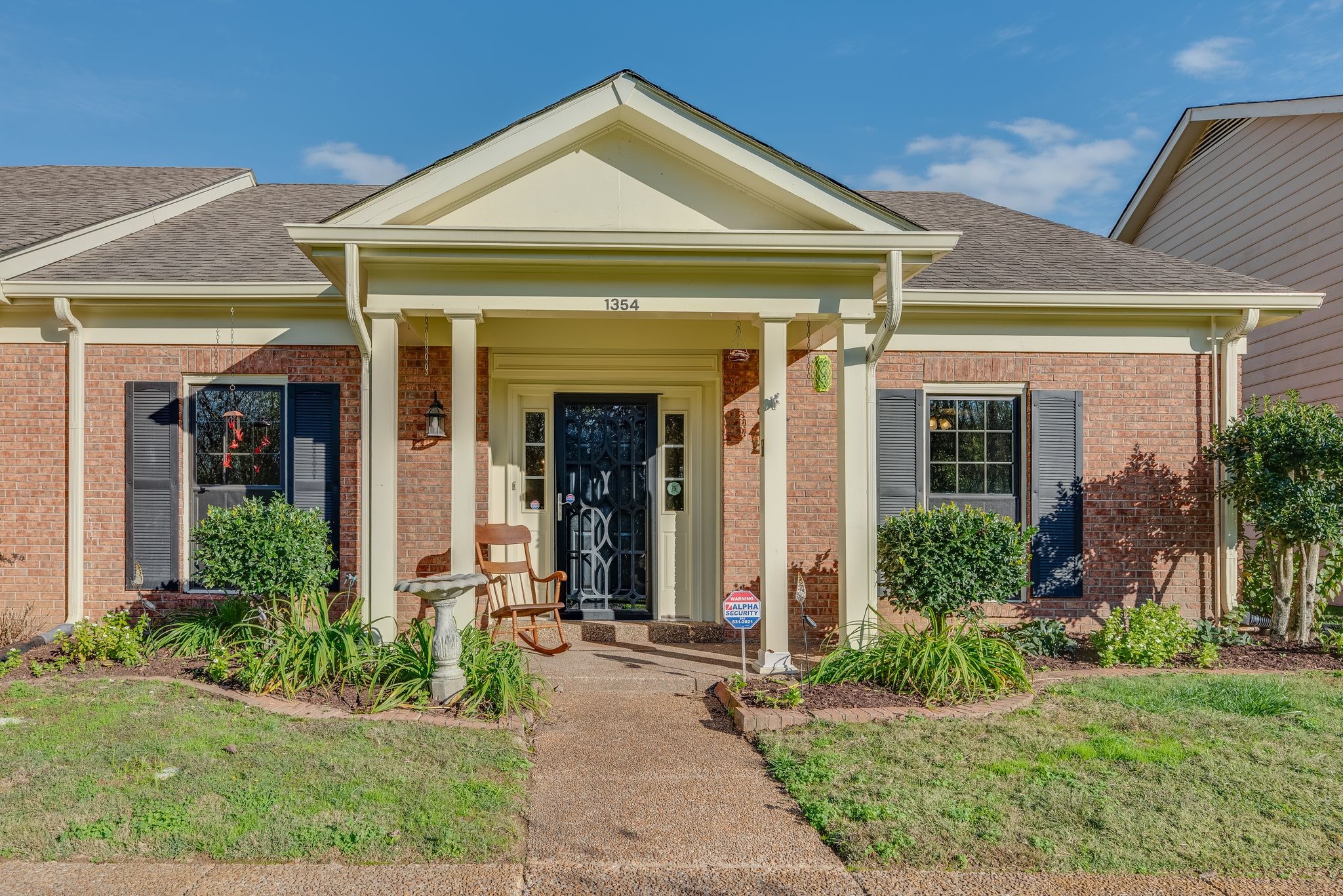 front view of a house with a small yard