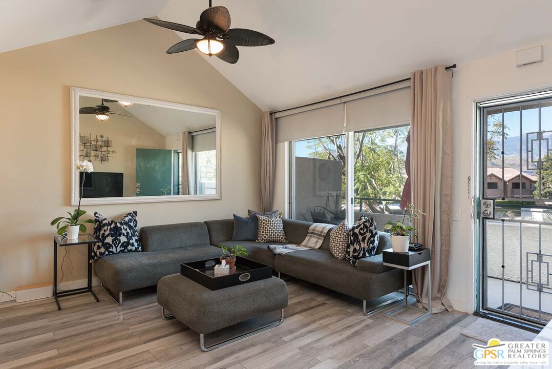 a living room with furniture and a large window