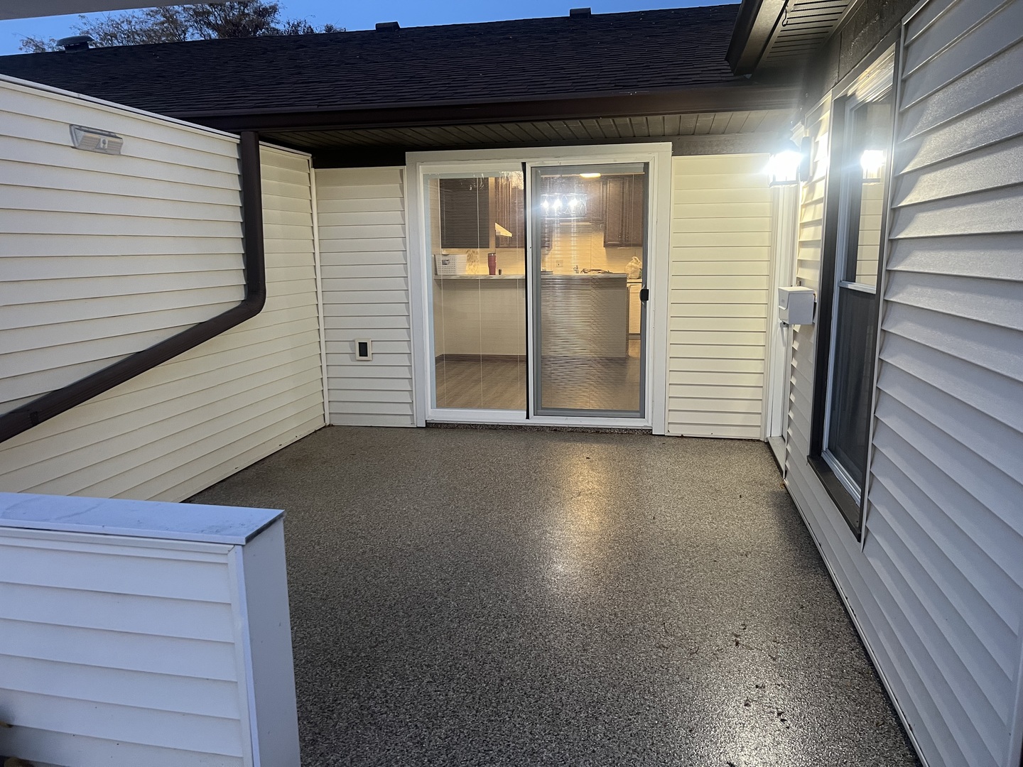 a view of front door and deck of the house