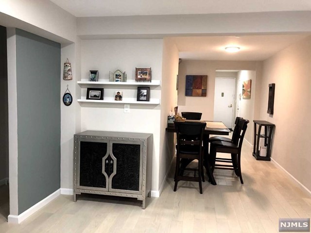 a living room with furniture a fireplace and a table