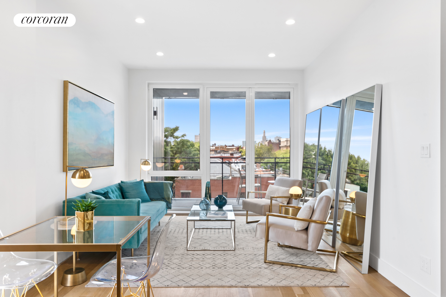 a living room with furniture and large windows