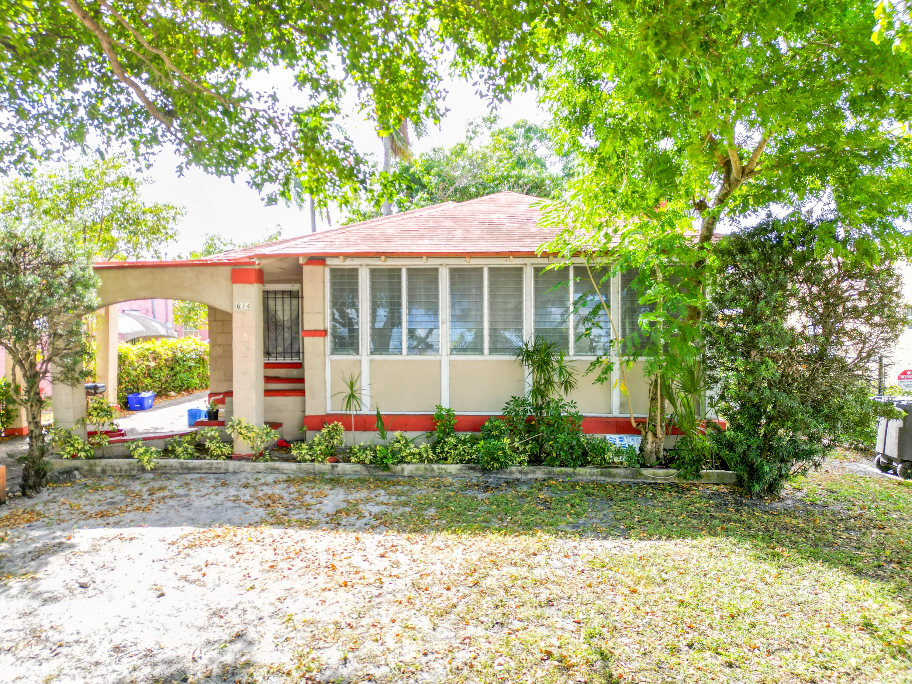 a front view of a house with a yard and table and chairs