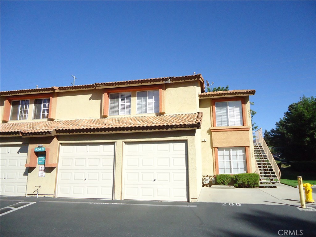 a front view of a house with a garage