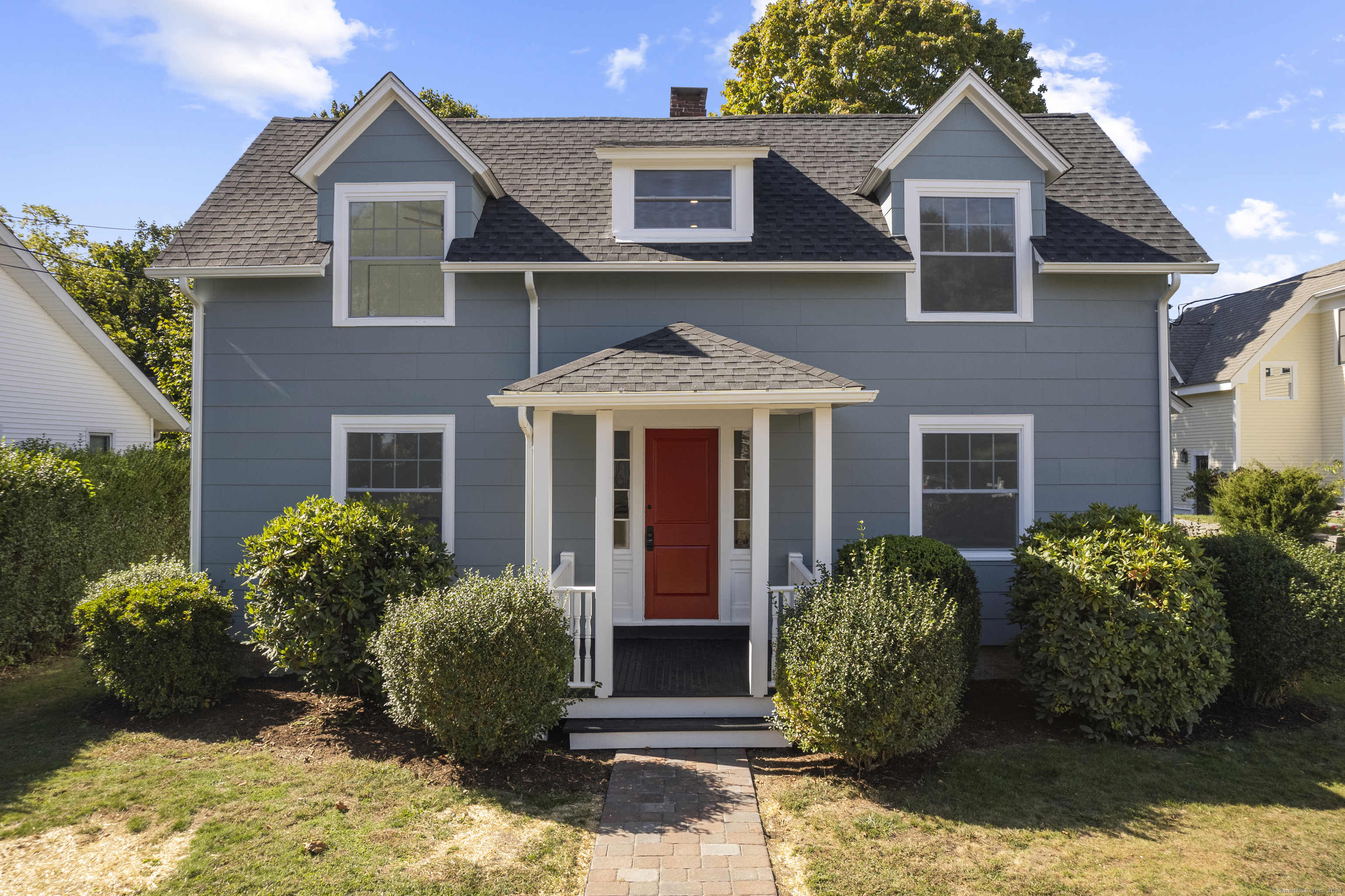 a front view of a house with garden