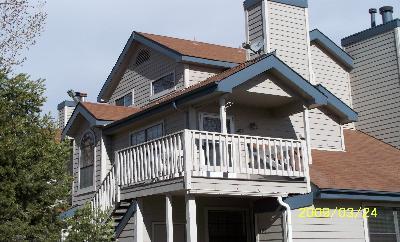 front view of a house with a deck