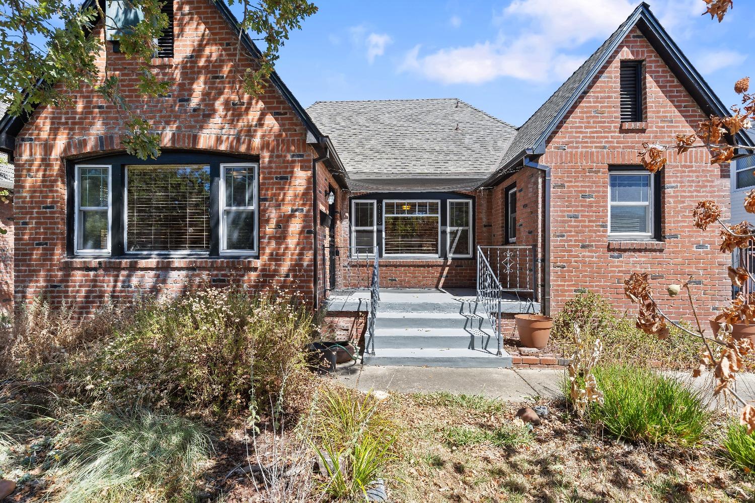 front view of a house with a small yard