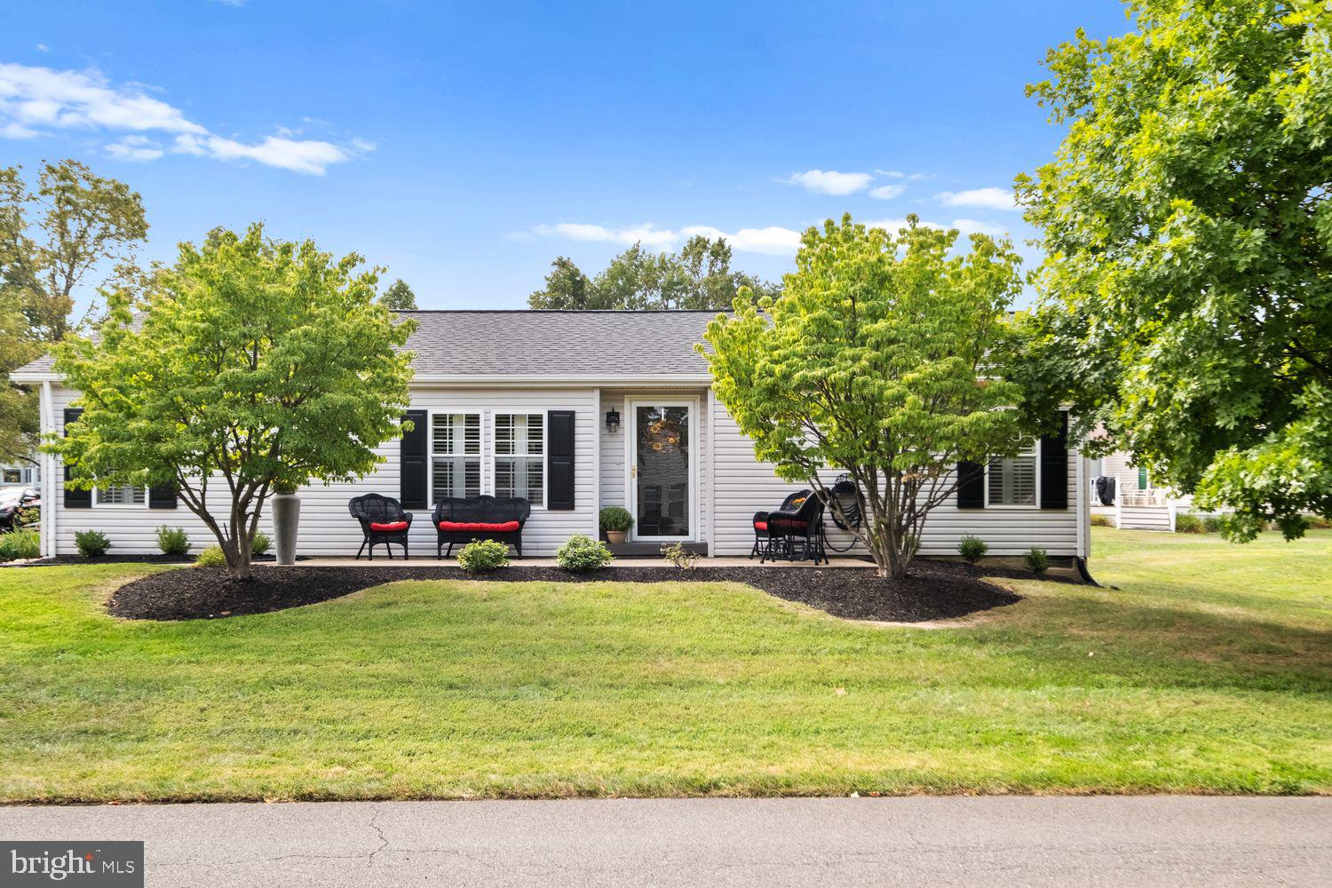 a view of a house with backyard porch and sitting area