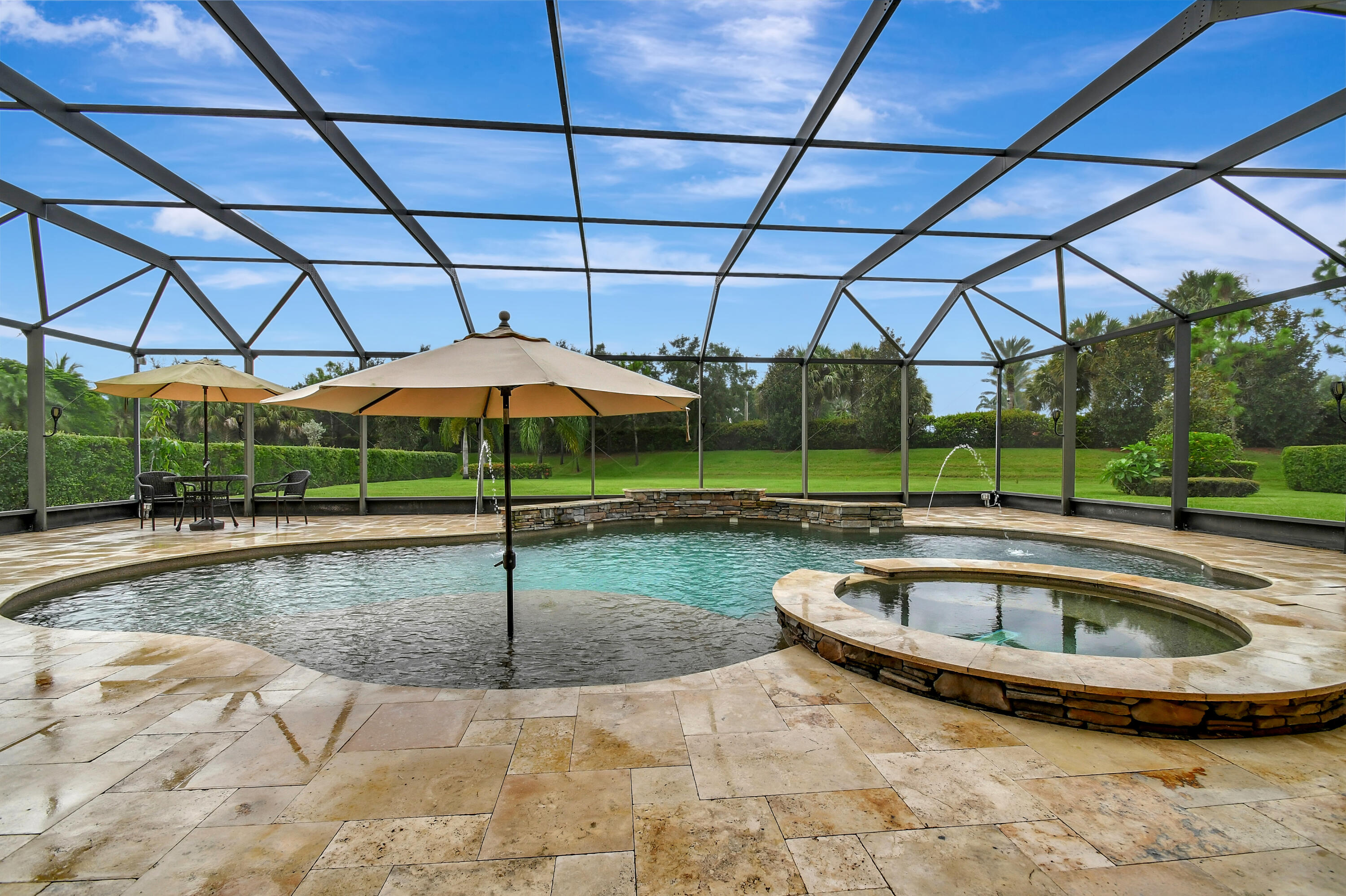 a view of a backyard with swimming pool