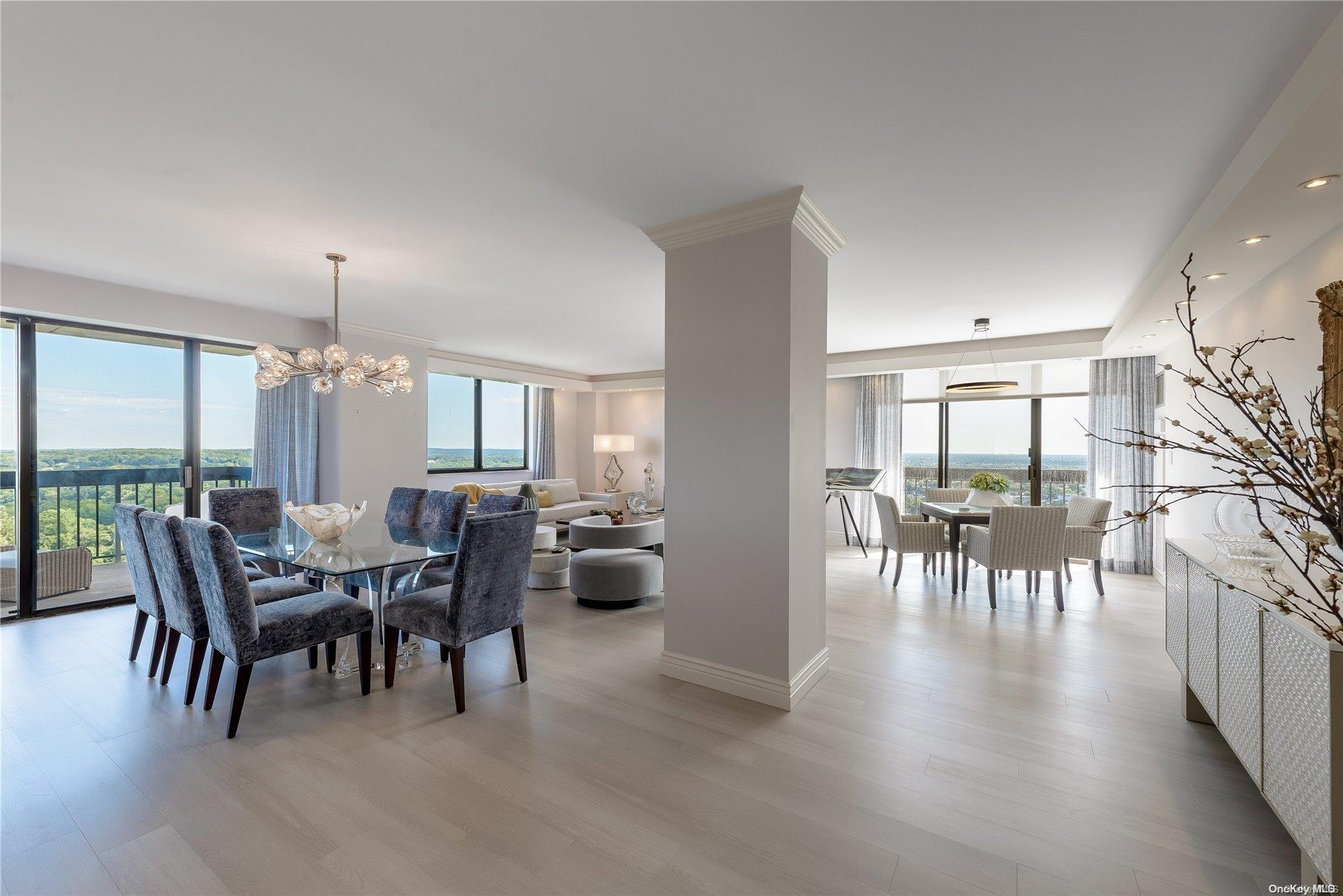 a dining room with furniture window and wooden floor